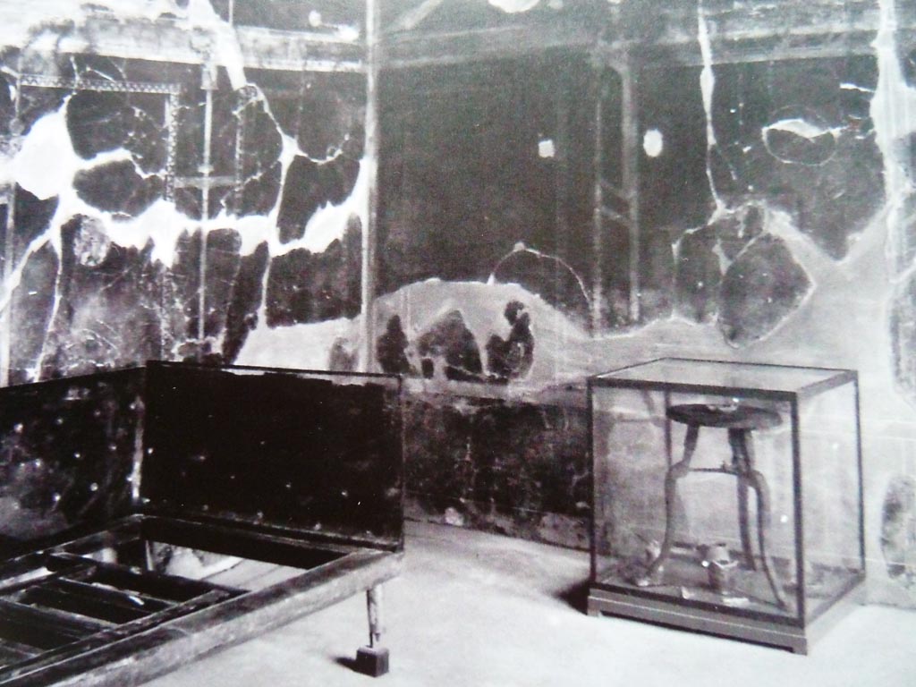 V.5 Herculaneum. Room 8, looking towards corner of room with carbonised wooden bed and table, in room with three windows.
Photo with kind permission of Prof. Andrew Wallace-Hadrill.
See Wallace-Hadrill, A. (2011). Herculaneum, Past and Future. London, Frances Lincoln Ltd., (p.216/217)